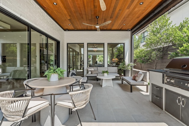 view of patio / terrace with a ceiling fan, an outdoor living space, and grilling area