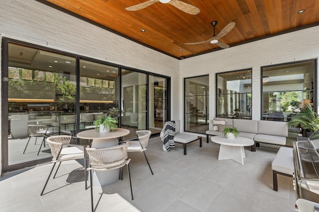 view of patio / terrace with a ceiling fan and an outdoor living space