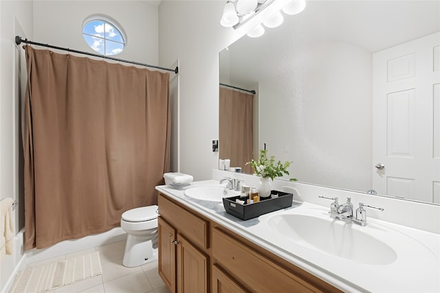 1707 Wheatberry Ln, Allen, TX 75002 - bathroom with tile patterned floors, toilet, double vanity, and shower / bath combo with shower curtain
