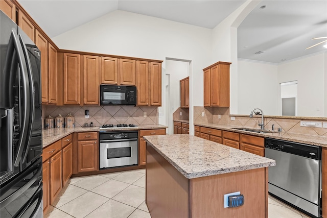 1707 Wheatberry Ln, Allen, TX 75002 - kitchen featuring black appliances, a sink, light stone countertops, backsplash, and vaulted ceiling
