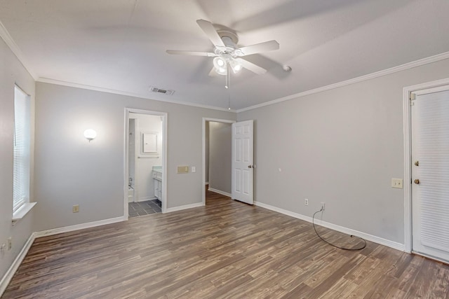 unfurnished bedroom featuring wood finished floors, ornamental molding, baseboards, connected bathroom, and a ceiling fan
