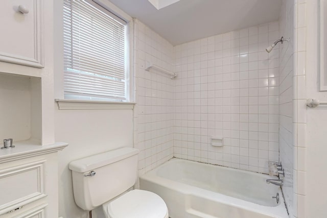 bathroom with toilet and washtub / shower combination