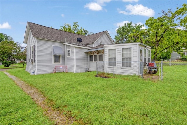 1231 W Woodard St, Denison, TX 75020 - rear view of house with roof with shingles and a sunroom
