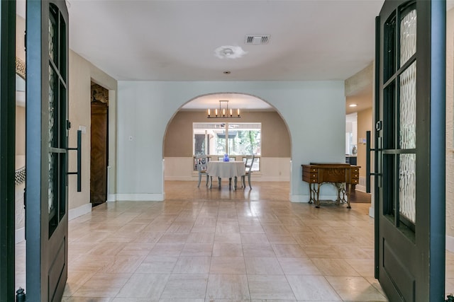 410 E Beady Rd, Arlington, TX 76006 - entrance foyer with arched walkways and a chandelier