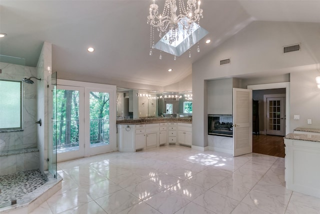 410 E Beady Rd, Arlington, TX 76006 - full bathroom with plenty of natural light, a marble finish shower, marble finish flooring, recessed lighting, and high vaulted ceiling