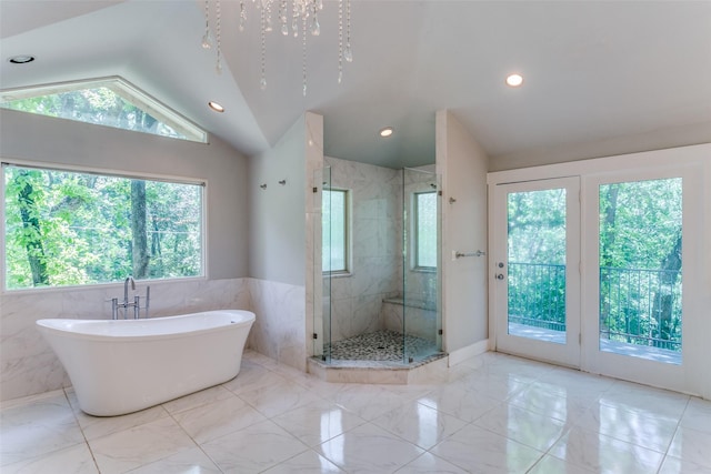 410 E Beady Rd, Arlington, TX 76006 - full bath featuring lofted ceiling, a freestanding tub, a shower stall, recessed lighting, and marble finish floors