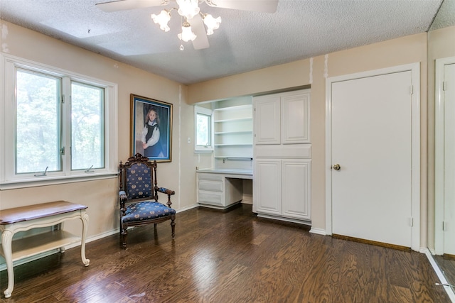 410 E Beady Rd, Arlington, TX 76006 - sitting room with a ceiling fan, dark wood-style flooring, a textured ceiling, and baseboards