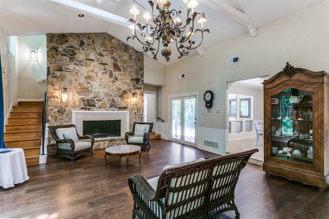 410 E Beady Rd, Arlington, TX 76006 - living area featuring wood finished floors, stairs, high vaulted ceiling, a chandelier, and a fireplace