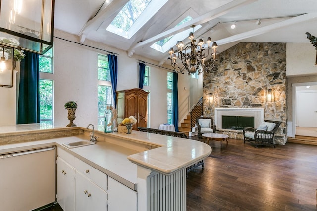 410 E Beady Rd, Arlington, TX 76006 - kitchen with dishwashing machine, a sink, a skylight, beam ceiling, and a chandelier