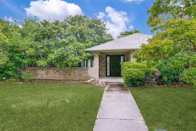 1926 Kensington Dr, Carrollton, TX 75007 - entrance to property with a yard, a chimney, and roof with shingles