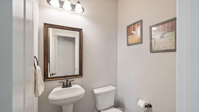 bathroom with a sink and toilet