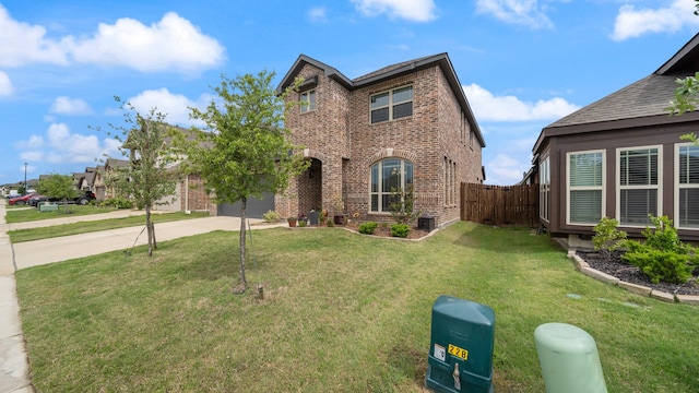 view of front of home with driveway, brick siding, and central AC