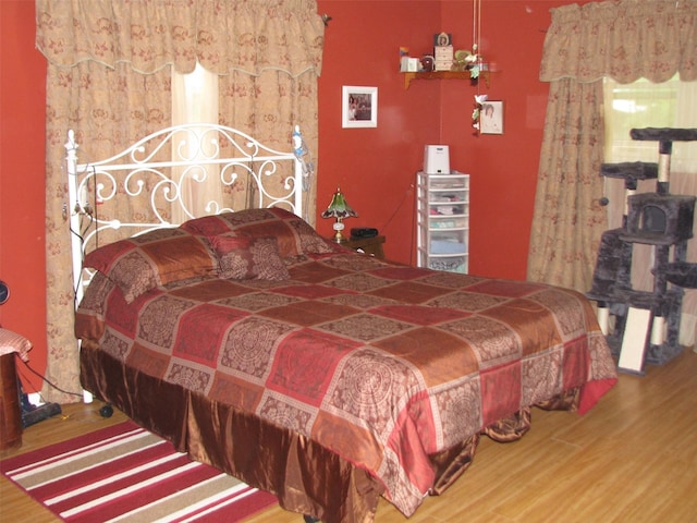 bedroom featuring wood finished floors