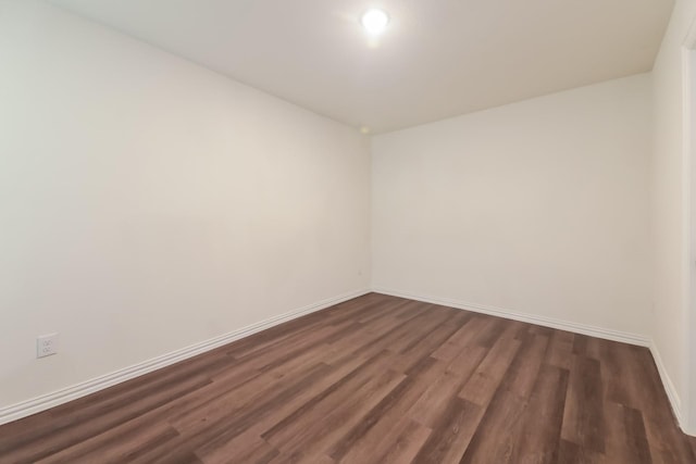 510 E Shepherd St, Denison, TX 75021 - unfurnished room with dark wood-style flooring and baseboards