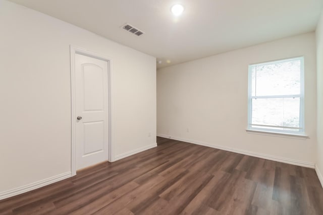 510 E Shepherd St, Denison, TX 75021 - empty room featuring dark wood-style floors and baseboards