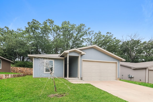 510 E Shepherd St, Denison, TX 75021 - view of front of home featuring a front yard, driveway, and an attached garage