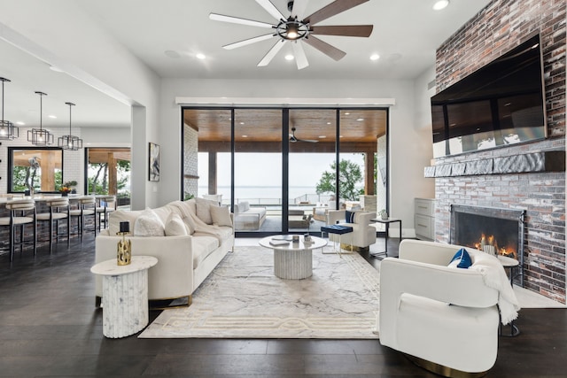 1210 Emerald Sound Blvd, Oak Point, TX 75068 - living room featuring a ceiling fan, a brick fireplace, plenty of natural light, and recessed lighting