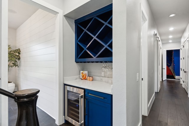 1210 Emerald Sound Blvd, Oak Point, TX 75068 - indoor dry bar featuring beverage cooler, a barn door, dark wood-style flooring, recessed lighting, and baseboards