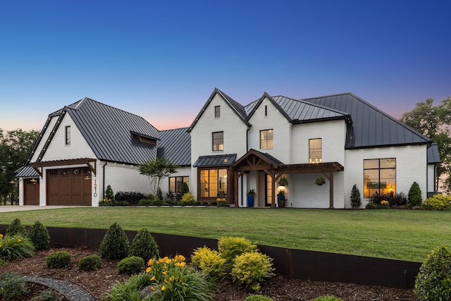1210 Emerald Sound Blvd, Oak Point, TX 75068 - modern farmhouse with a standing seam roof, metal roof, a front lawn, concrete driveway, and an attached garage