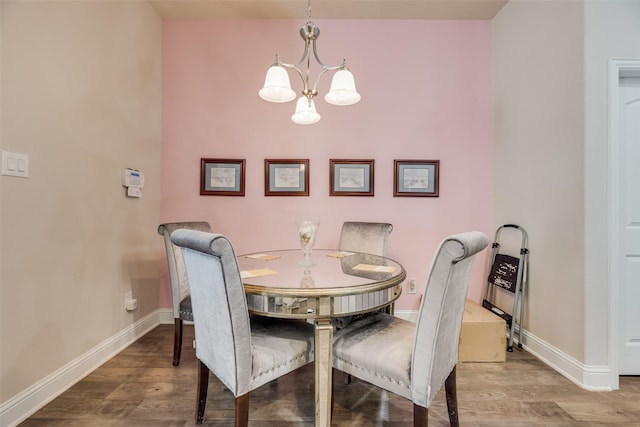 1537 Firenza Ct, Mclendon Chisholm, TX 75032 - dining area with a chandelier, baseboards, and wood finished floors