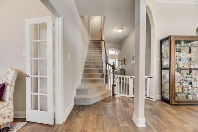 1537 Firenza Ct, Mclendon Chisholm, TX 75032 - entryway with arched walkways, wood finished floors, and baseboards
