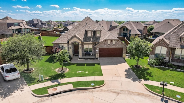 1537 Firenza Ct, Mclendon Chisholm, TX 75032 - view of front of home with concrete driveway, a residential view, brick siding, a front lawn, and a garage