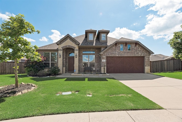 1537 Firenza Ct, Mclendon Chisholm, TX 75032 - french country home featuring brick siding, concrete driveway, an attached garage, and roof with shingles