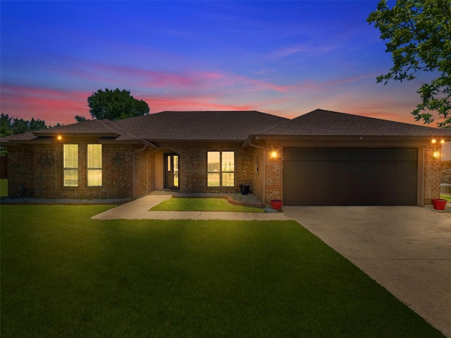 3804 Chestnut St, Fort Worth, TX 76137 - prairie-style house featuring driveway, a garage, brick siding, and a yard