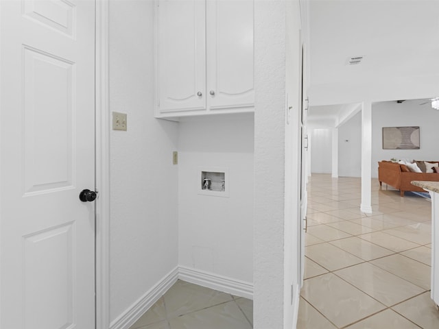3804 Chestnut St, Fort Worth, TX 76137 - washroom with cabinet space, washer hookup, baseboards, and light tile patterned flooring