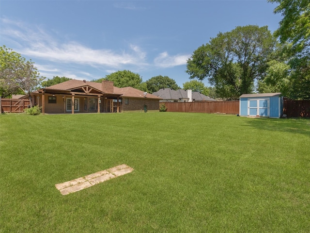 3804 Chestnut St, Fort Worth, TX 76137 - view of yard featuring a storage unit, an outbuilding, and french doors