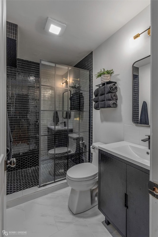 4131 Waller Dr, Shreveport, LA 71119 - bathroom featuring marble look tiles, toilet, vanity, and a stall shower