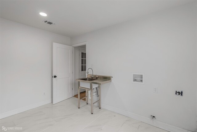 4131 Waller Dr, Shreveport, LA 71119 - office with light marble finish floors, a sink, and baseboards