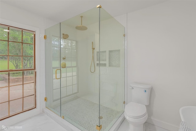 4131 Waller Dr, Shreveport, LA 71119 - bathroom with a stall shower, toilet, marble look tile flooring, and baseboards
