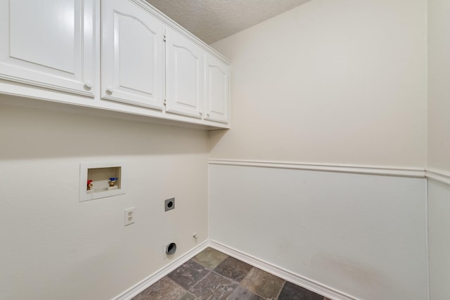 907 Sunpoint Cir, Rockwall, TX 75087 - laundry room with electric dryer hookup, cabinet space, baseboards, washer hookup, and dark stone finish floors