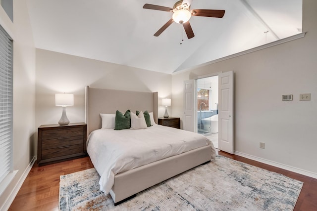 907 Sunpoint Cir, Rockwall, TX 75087 - bedroom featuring vaulted ceiling, wood finished floors, ensuite bath, baseboards, and a ceiling fan