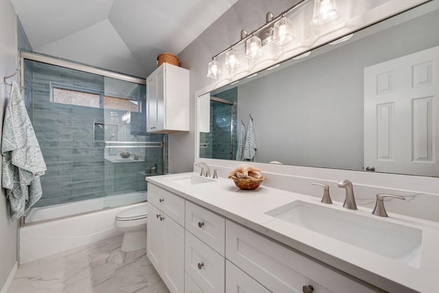 907 Sunpoint Cir, Rockwall, TX 75087 - full bathroom featuring toilet, enclosed tub / shower combo, double vanity, marble finish floors, and lofted ceiling