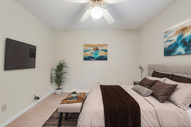 907 Sunpoint Cir, Rockwall, TX 75087 - carpeted bedroom with baseboards and ceiling fan