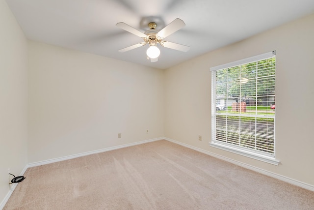 907 Sunpoint Cir, Rockwall, TX 75087 - empty room with baseboards, light colored carpet, and a ceiling fan