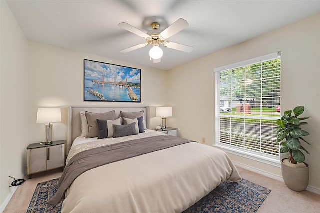 907 Sunpoint Cir, Rockwall, TX 75087 - carpeted bedroom featuring baseboards and ceiling fan