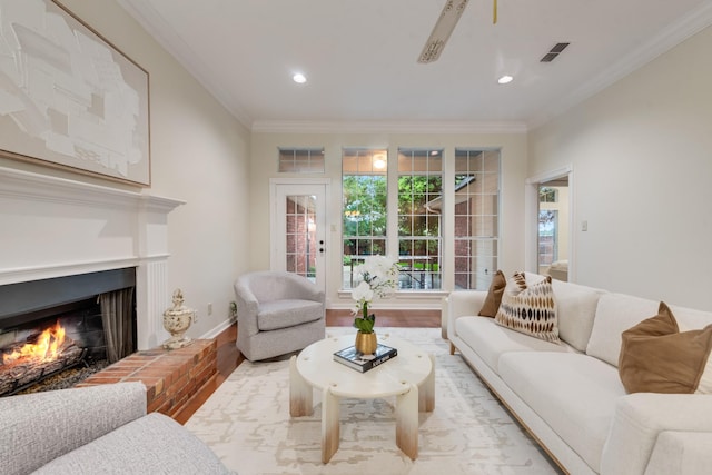 907 Sunpoint Cir, Rockwall, TX 75087 - living room with wood finished floors, a fireplace, ornamental molding, recessed lighting, and baseboards