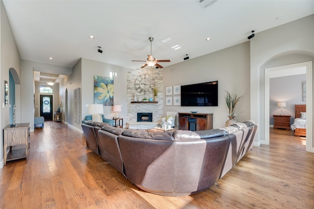 106 Magnolia Ln, Hickory Creek, TX 75065 - living area with ceiling fan, a fireplace, light wood-style floors, baseboards, and recessed lighting