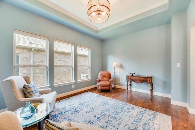 106 Magnolia Ln, Hickory Creek, TX 75065 - sitting room featuring a chandelier, wood finished floors, baseboards, a tray ceiling, and crown molding