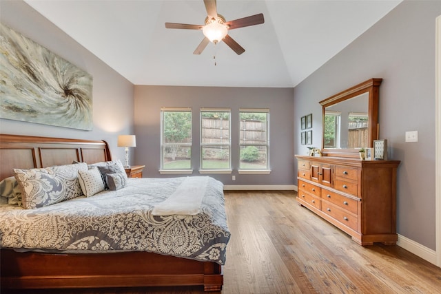 106 Magnolia Ln, Hickory Creek, TX 75065 - bedroom featuring baseboards, multiple windows, light wood-style flooring, lofted ceiling, and a ceiling fan