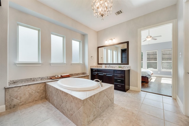 106 Magnolia Ln, Hickory Creek, TX 75065 - bathroom with a bath, vanity, tile patterned floors, a chandelier, and baseboards