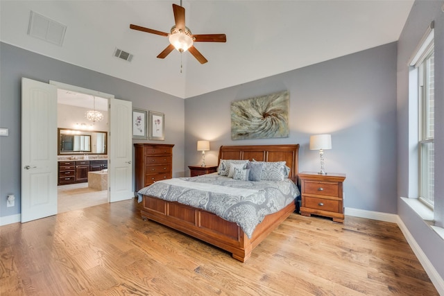 106 Magnolia Ln, Hickory Creek, TX 75065 - bedroom featuring light wood-type flooring, baseboards, lofted ceiling, ensuite bath, and ceiling fan