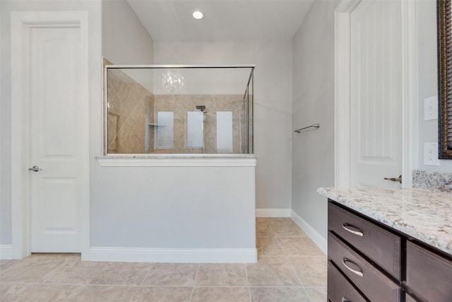 106 Magnolia Ln, Hickory Creek, TX 75065 - bathroom featuring vanity, walk in shower, baseboards, and tile patterned floors