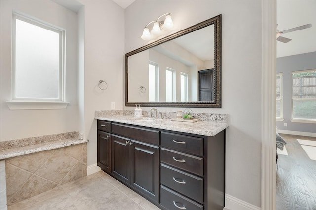 106 Magnolia Ln, Hickory Creek, TX 75065 - bathroom featuring vanity, baseboards, and tile patterned floors