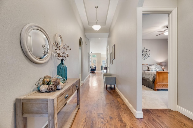 106 Magnolia Ln, Hickory Creek, TX 75065 - hallway with wood finished floors, arched walkways, and baseboards