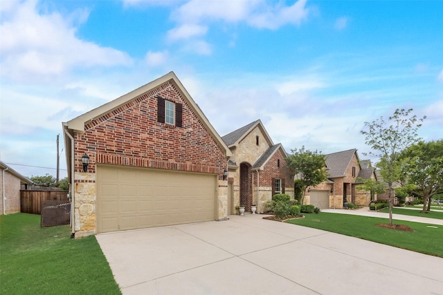 106 Magnolia Ln, Hickory Creek, TX 75065 - view of front facade with concrete driveway, brick siding, stone siding, and a garage