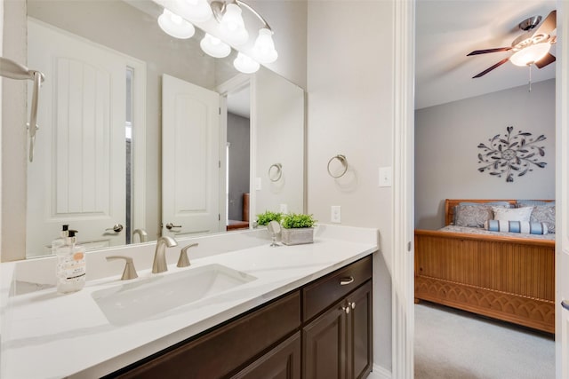 bathroom with ceiling fan, vanity, and ensuite bath